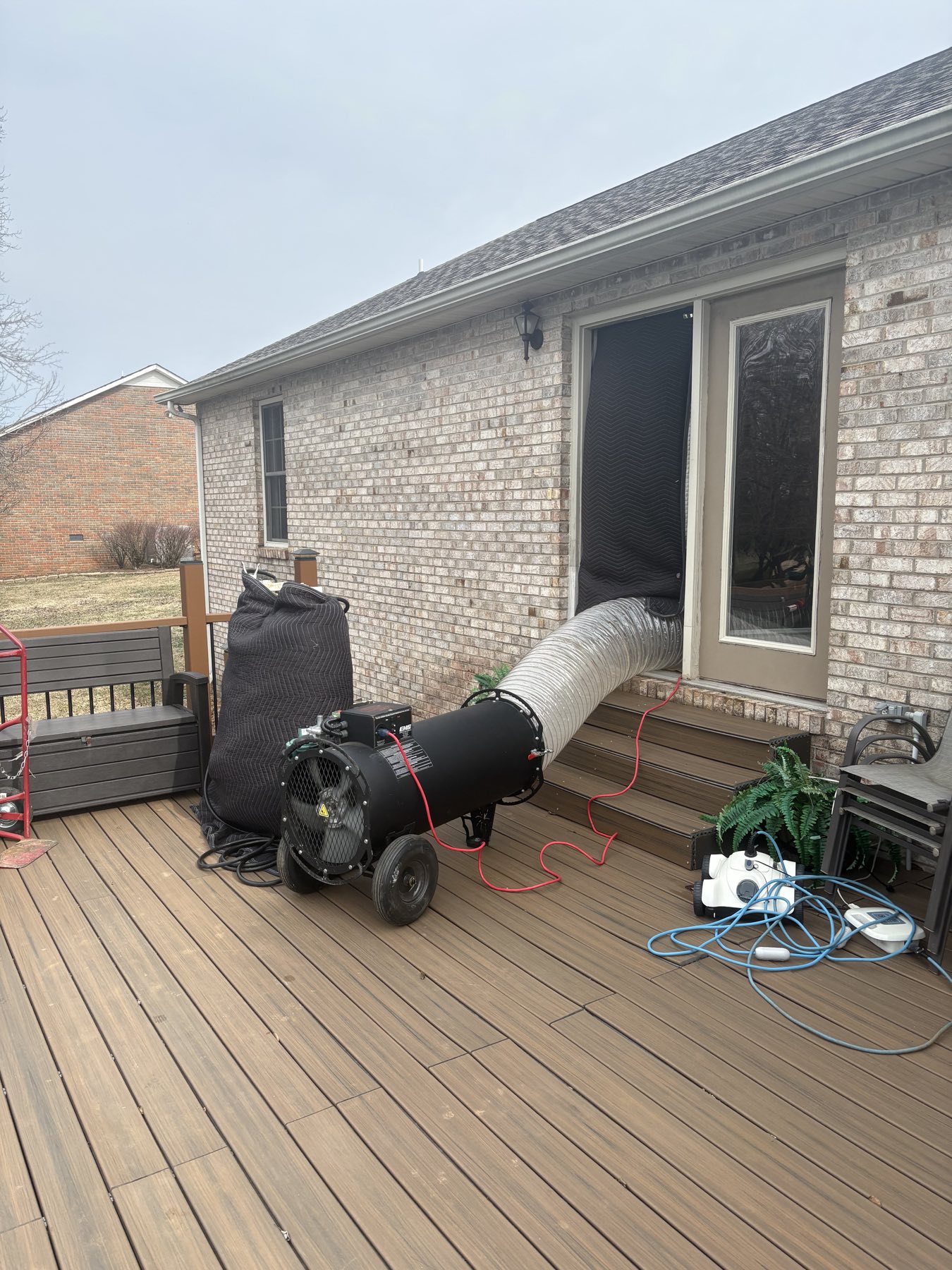 EcoForce bed bug heat treatment equipment feeding a brick home in the Nashville area