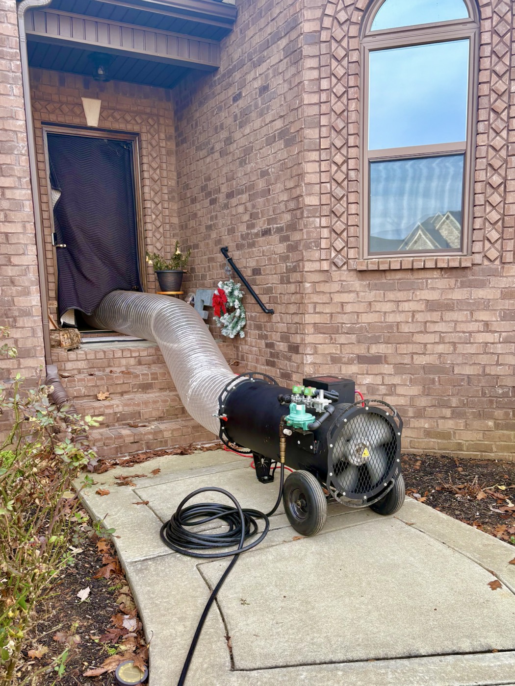 EcoForce bed bug heat treatment equipment routed into a Middle Tennessee home during a residential treatment setup